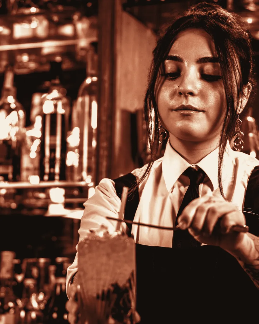 Bartender stirring a cocktail